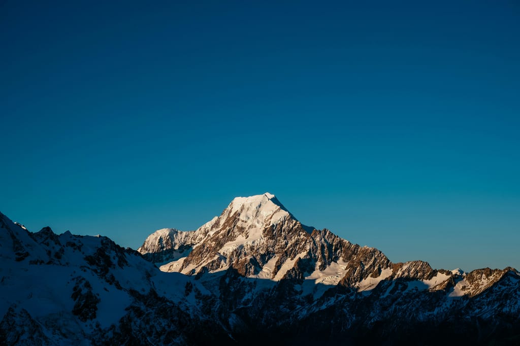 Snow-capped mountain range at dusk